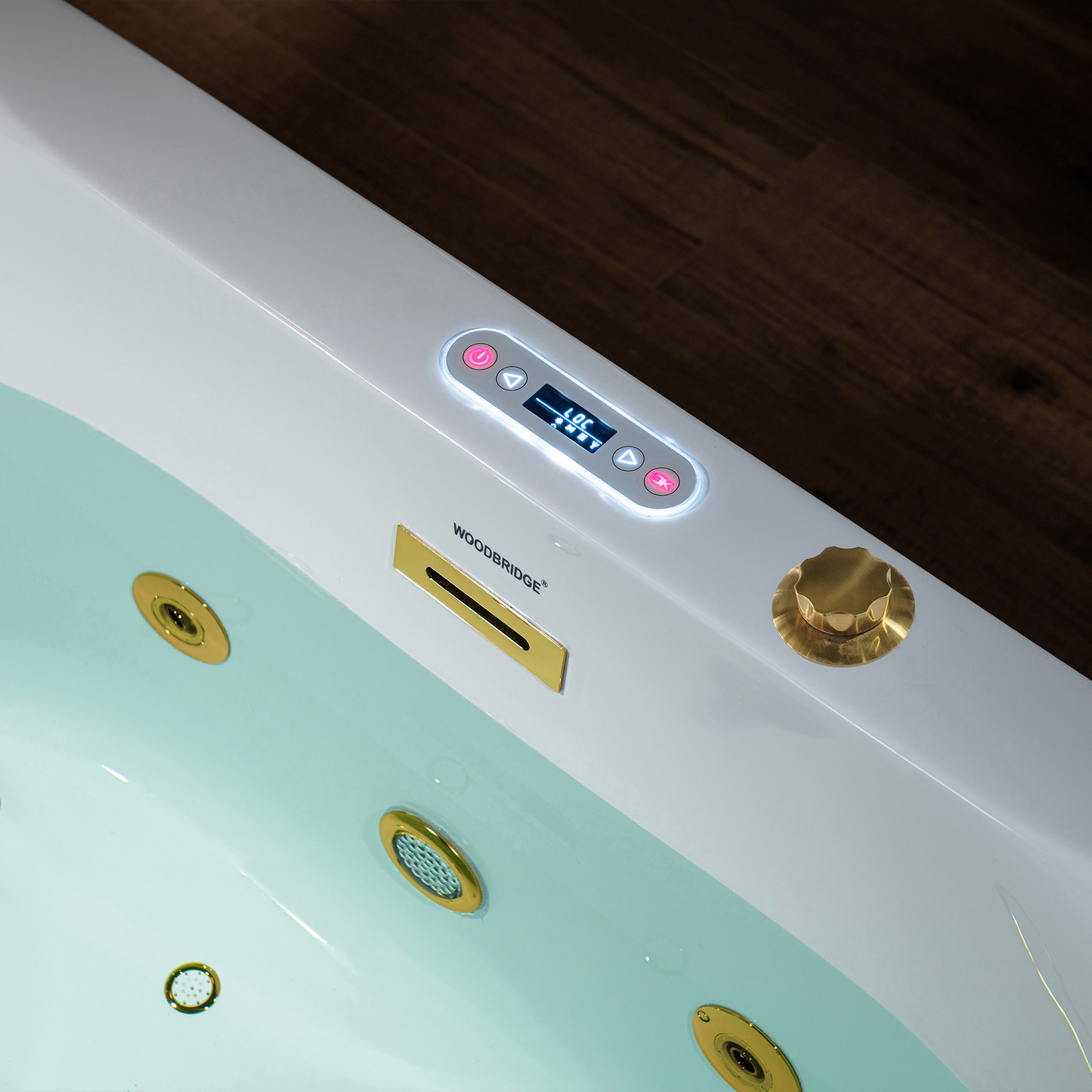 Close-up detail of brushed gold full-draining jets and LED controls on Woodbridge BG100 59" acrylic freestanding bathtub with air and whirlpool massage.png